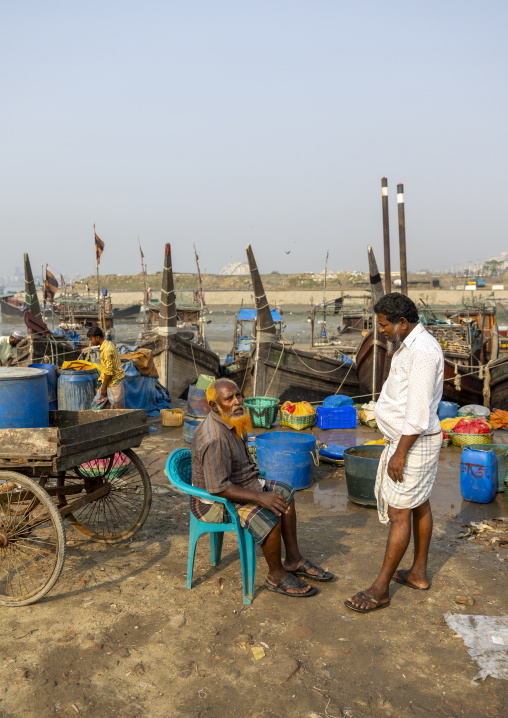 Bangladeshi man selling fishes in fish market, Chittagong Division, Chittagong, Bangladesh