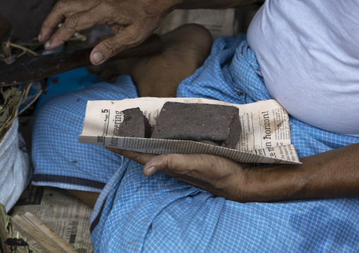 Chakma tribe man selling sidol shrimp paste, Chittagong Division, Rangamati Sadar, Bangladesh