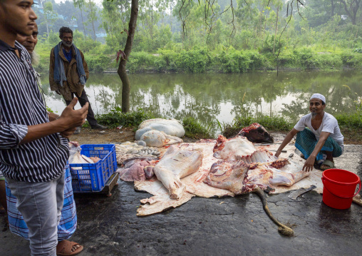 Butcher selling cow meat freshly killed along the road, Dhaka Division, Tongibari, Bangladesh