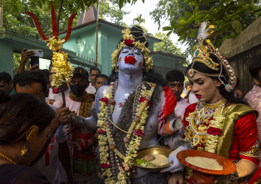 Lord Shiva and Parvati procession with devotees during Lal Kach festival, Dhaka Division, Tongibari, Bangladesh