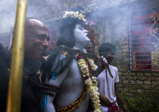 Lord Shiva procession with devotees at Lal Kach festival, Dhaka Division, Tongibari, Bangladesh