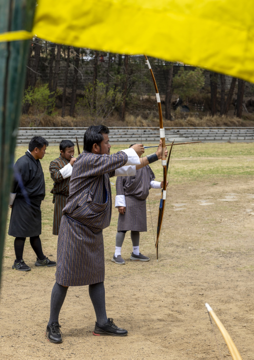 Bhutanese man aims arrow in archery competition, Chang Gewog, Thimphu, Bhutan