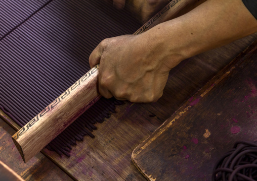 Bhutanese woman manufacturing Incense sticks in Nado Poizokhang , Chang Gewog, Thimphu, Bhutan