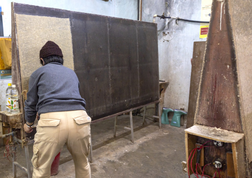 Bhutanese man drying traditional paper, Chang Gewog, Thimphu, Bhutan