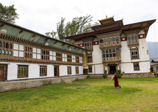 Bhutanese monk in Nyenzer Lhakhang courtyard, Thedtsho Gewog, Wangdue Phodrang, Bhutan