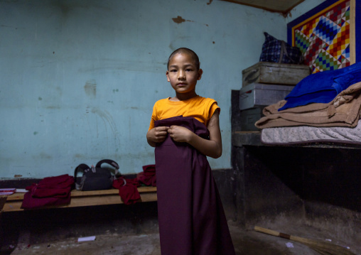 Bhutanese novice monk in Nyenzer Lhakhang dormitory, Thedtsho Gewog, Wangdue Phodrang, Bhutan