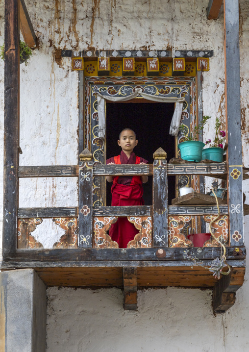 Bhutanese novices monks on balcony in Nyenzer Lhakhang, Thedtsho Gewog, Wangdue Phodrang, Bhutan