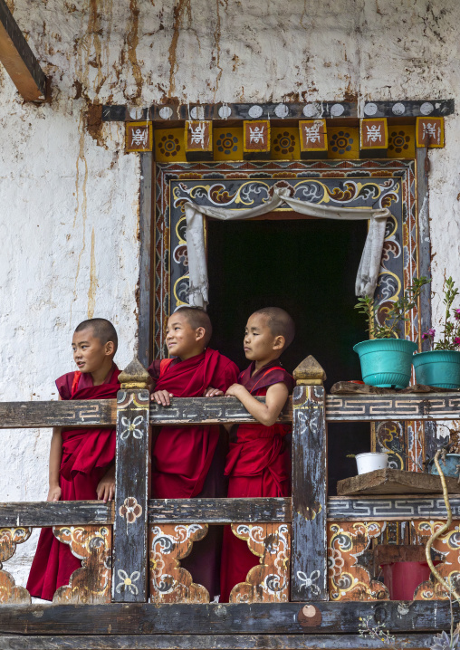 Bhutanese novices monks on balcony in Nyenzer Lhakhang, Thedtsho Gewog, Wangdue Phodrang, Bhutan