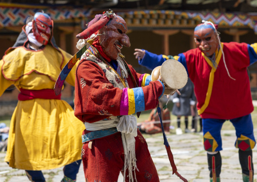 Masked atsaras at the annual Ura Yakchoe festival, Bumthang, Ura, Bhutan