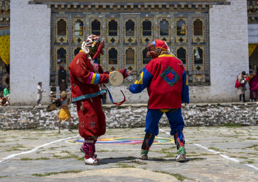 Masked atsaras at the annual Ura Yakchoe festival, Bumthang, Ura, Bhutan