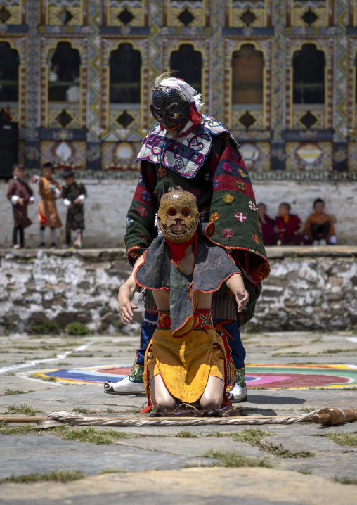 Masked atsaras at the annual Ura Yakchoe festival, Bumthang, Ura, Bhutan