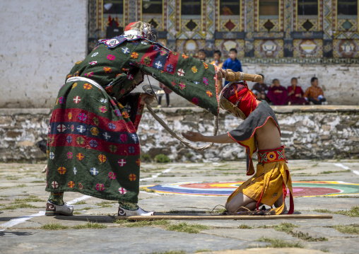 Masked atsaras at the annual Ura Yakchoe festival, Bumthang, Ura, Bhutan