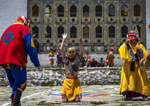 Masked atsaras at the annual Ura Yakchoe festival, Bumthang, Ura, Bhutan