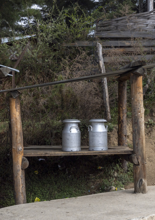 Milk churns along the road, Chhoekhor Gewog, Bumthang, Bhutan