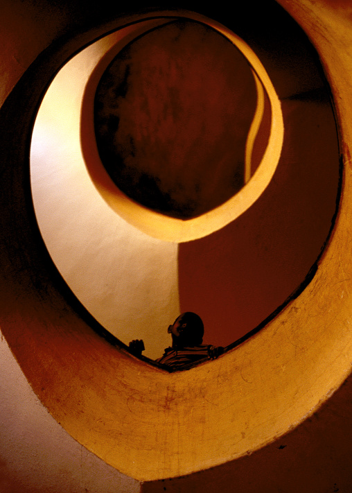 Eritrean boy looking down in an art deco stairs, Central Region, Asmara, Eritrea