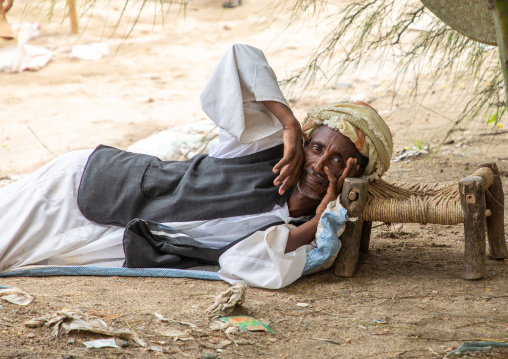 Eritrean man resting on a small seat, Semien-Keih-Bahri, Keren, Eritrea