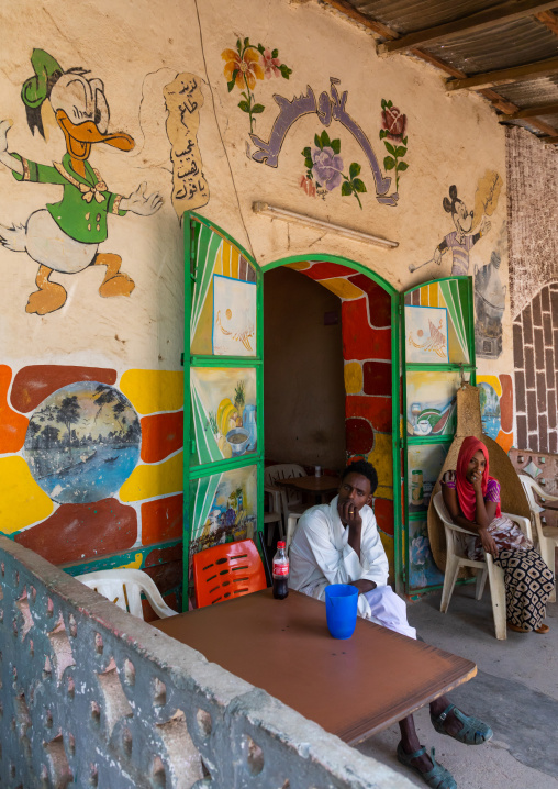 Eritrean people in a bar decorated with disney characters, Gash-Barka, Agordat, Eritrea