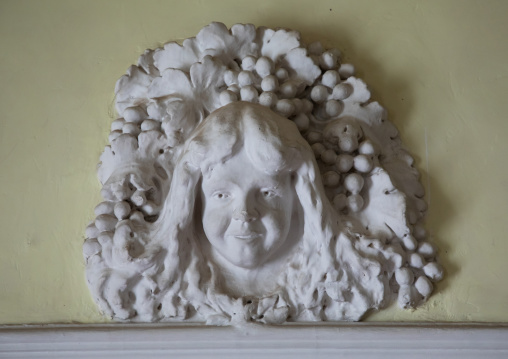 Statue of the white angel above a door in albergo italia hotel, Central region, Asmara, Eritrea