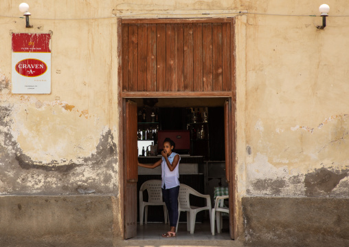 Eritrean woman at the entrance of a restaurant, Northern Red Sea, Massawa, Eritrea