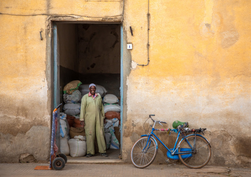 Eritrean man in front of a grain warehouse, Central region, Asmara, Eritrea