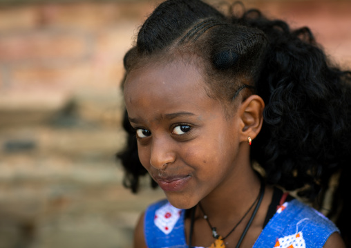 Portrairt of an eritrean orthodox girl with traditional hairstyle, Central region, Asmara, Eritrea