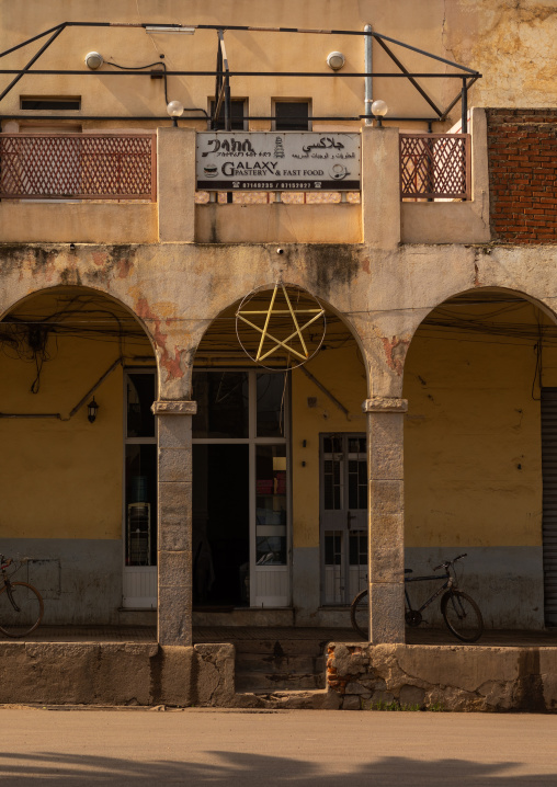 Exterior of old art deco style building with arches from the italian colonial times, Central region, Asmara, Eritrea