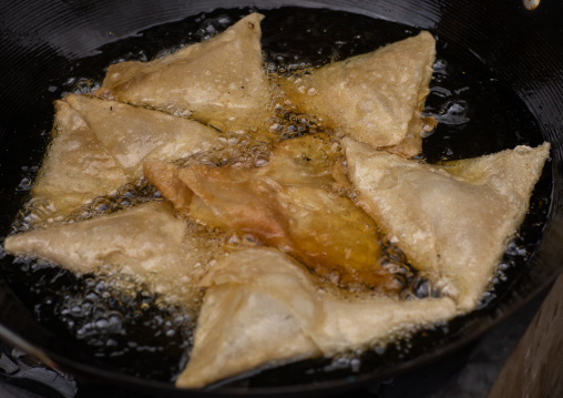 Samoussas cooking in oil, Central region, Asmara, Eritrea