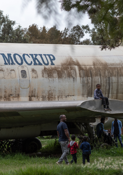 Eritrean children playing on a training mockup plane in expo, Central region, Asmara, Eritrea