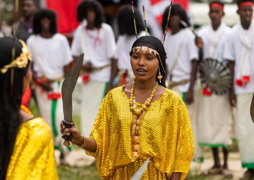 Afar tribe woman dancing with a jile knife during expo festival, Central region, Asmara, Eritrea