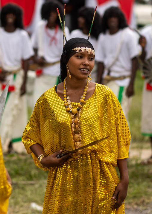 Afar tribe woman dancing with a jile knife during expo festival, Central region, Asmara, Eritrea