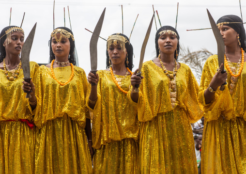 Afar tribe women dancing with a jile knife during expo festival, Central region, Asmara, Eritrea