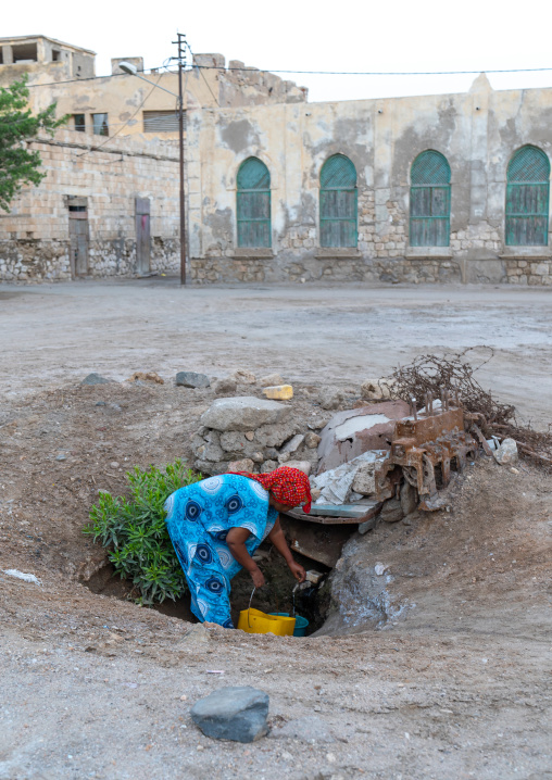 Eritrean woman collecting water in the town, Northern Red Sea, Massawa, Eritrea