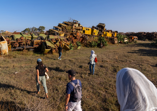 Tourists visiting military tank graveyard, Central Region, Asmara, Eritrea