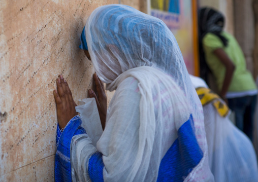 Eritrean women praying in front of a church, Central Region, Asmara, Eritrea