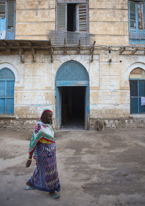 Eritrean passing in front of an ottoman house, Northern Red Sea, Massawa, Eritrea