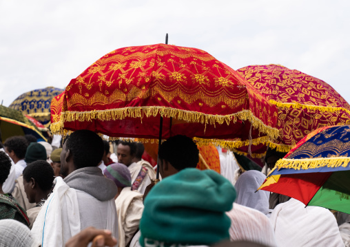 Ethiopian men under umbrellas during a celebration in Bilbaia Giorgis, Amhara Region, Lalibela, Ethiopia