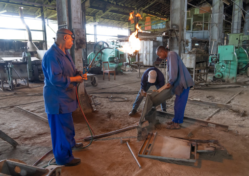 Ethiopian men working in the Dire Dawa train station workshop, Dire Dawa Region, Dire Dawa, Ethiopia