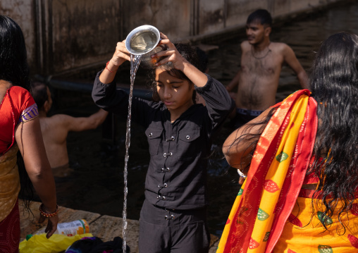 Indian pilgrims having a bath in Galtaji temple aka monkey temple, Rajasthan, Jaipur, India