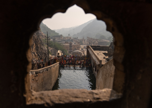 Indian pilgrims having a bath in Galtaji temple aka monkey temple, Rajasthan, Jaipur, India