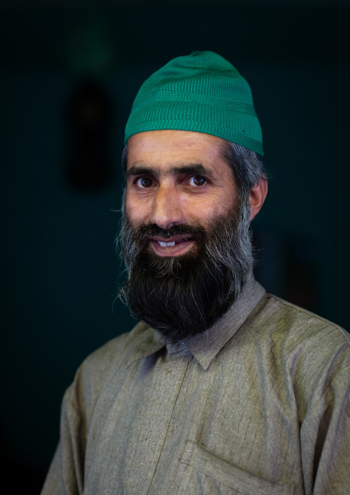 Portrait of a smiling Gujjar Bakerwal bearded man, Jammu and Kashmir, Kangan, India