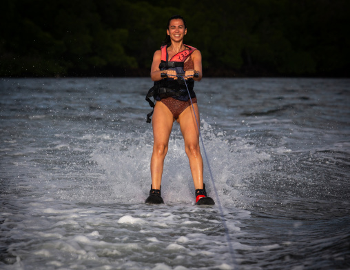 Young woman water skiing, Lamu County, Lamu, Kenya