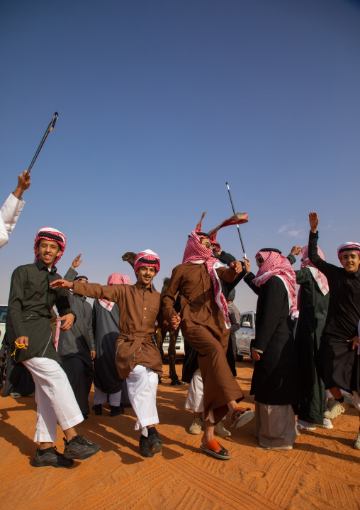 Saudi men dancing during King Abdul Aziz Camel Festival, Riyadh Province, Rimah, Saudi Arabia