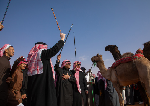 Saudi men dancing during King Abdul Aziz Camel Festival, Riyadh Province, Rimah, Saudi Arabia