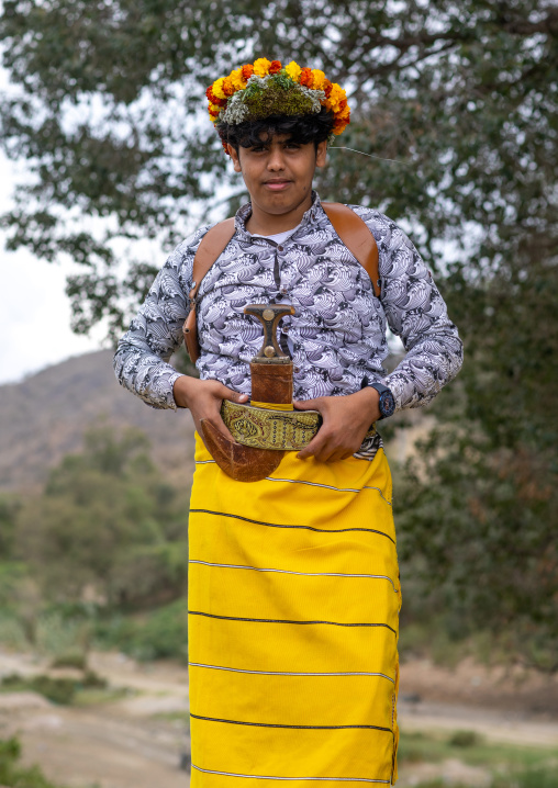 Portrait of a flower man wearing a floral crown on the head, Asir province, Sarat Abidah, Saudi Arabia