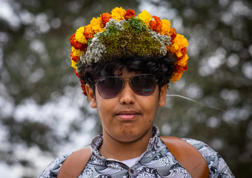 Portrait of a flower man wearing a floral crown on the head, Asir province, Sarat Abidah, Saudi Arabia