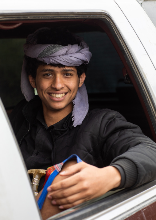 Portrait of a young man driving a car, Asir province, Sarat Abidah, Saudi Arabia