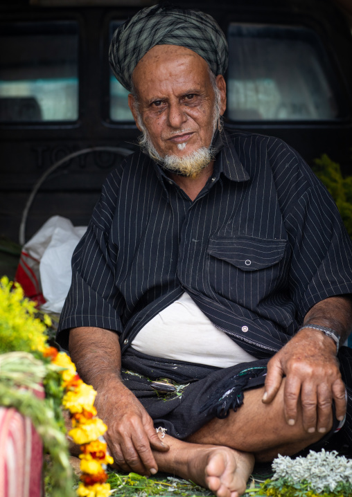 Man selling floral crowns in a market, Jazan province, Addayer, Saudi Arabia