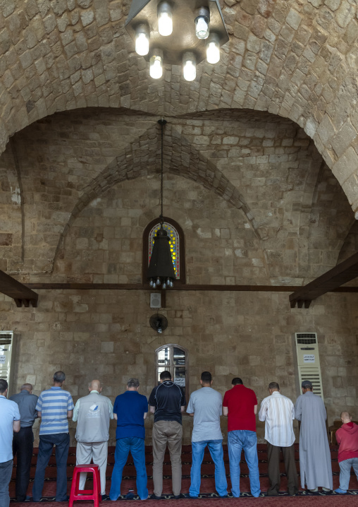 Men praying inside Al Mansouri Al Kabir mosque, North Governorate, Tripoli, Lebanon