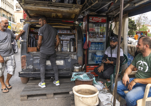 Men having a coffee in the back of a car, North Governorate, Tripoli, Lebanon