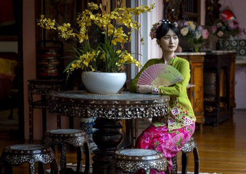 Young chinese woman dressed in traditional clothing in Pinang Peranakan mansion, Penang island, George Town, Malaysia